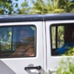 Visitors in a Jeep