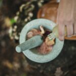Hand pouring oil